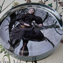 The Girl and the Raven Glass Round Paperweight
